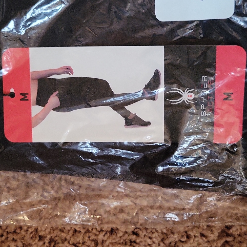 See Other Listing For This Item.NWT SPYDER active leggings, black print, pockets - Picture 9 of 11